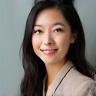 Professional photo of Sarah Chen smiling slightly.